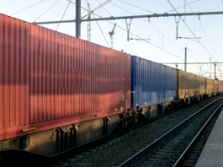 Freight train passing through a station