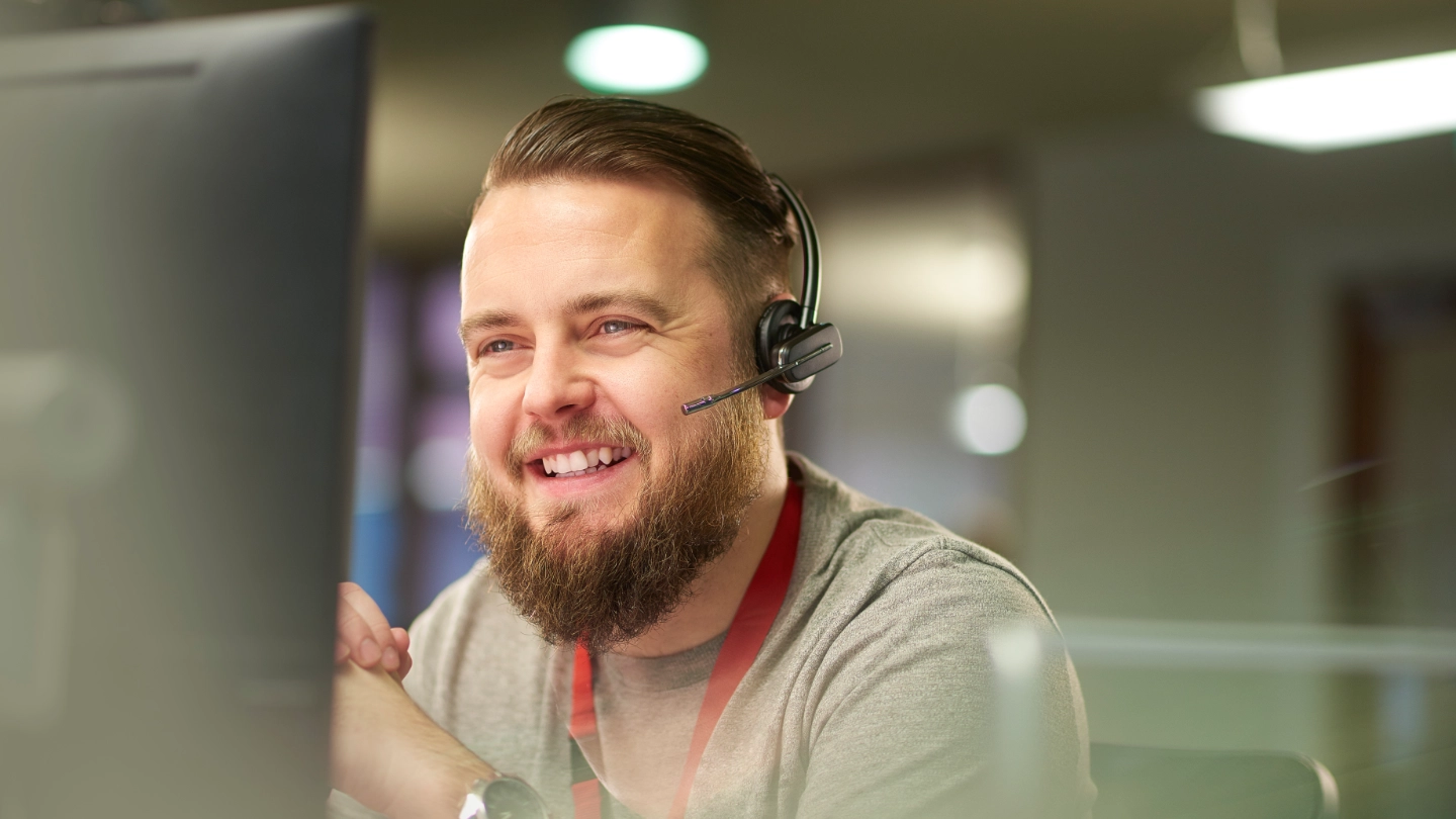 Male IT worker calling a client Male IT worker calling a client